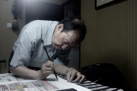Don Wong working at studio